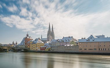 Regensburg at winter with the Cathedral and stone bridge, Germany Regensburg at winter with the Cathedral and stone bridge, Germany